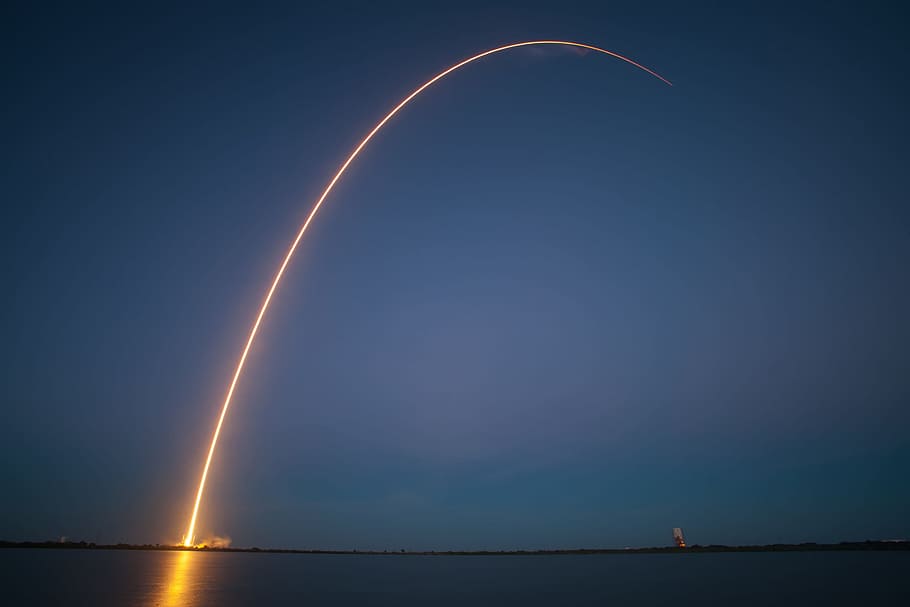 timelapse photography of rocket launching, fireworks, night, trajectory