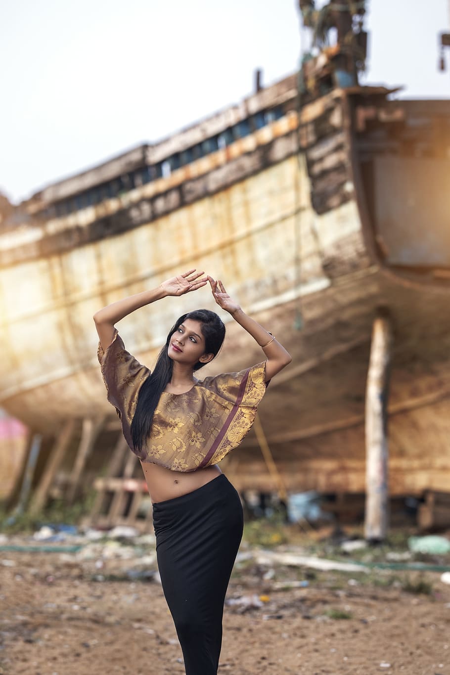 woman in brown floral crop top raising her hands near shipwreck, HD wallpaper