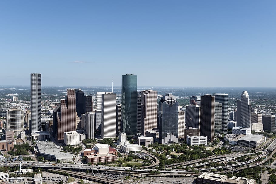 photo of brown and gray high rise buildings during daytime, aerial view houston skyline