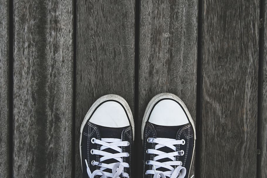 pair of black low-top sneakers on gray wooden floor, shoes HD wallpaper