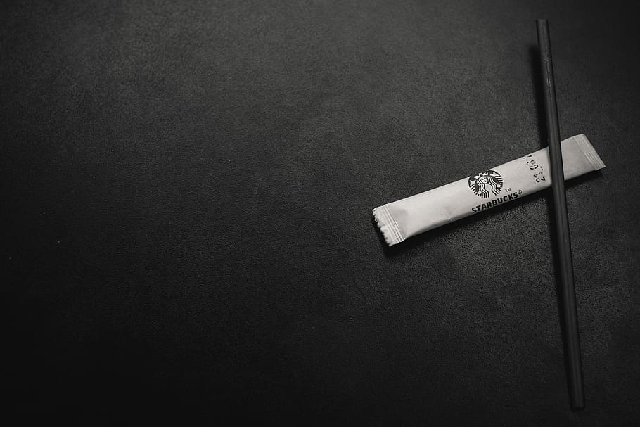 white soft-tube with stick, grayscale photography of pack, sugar