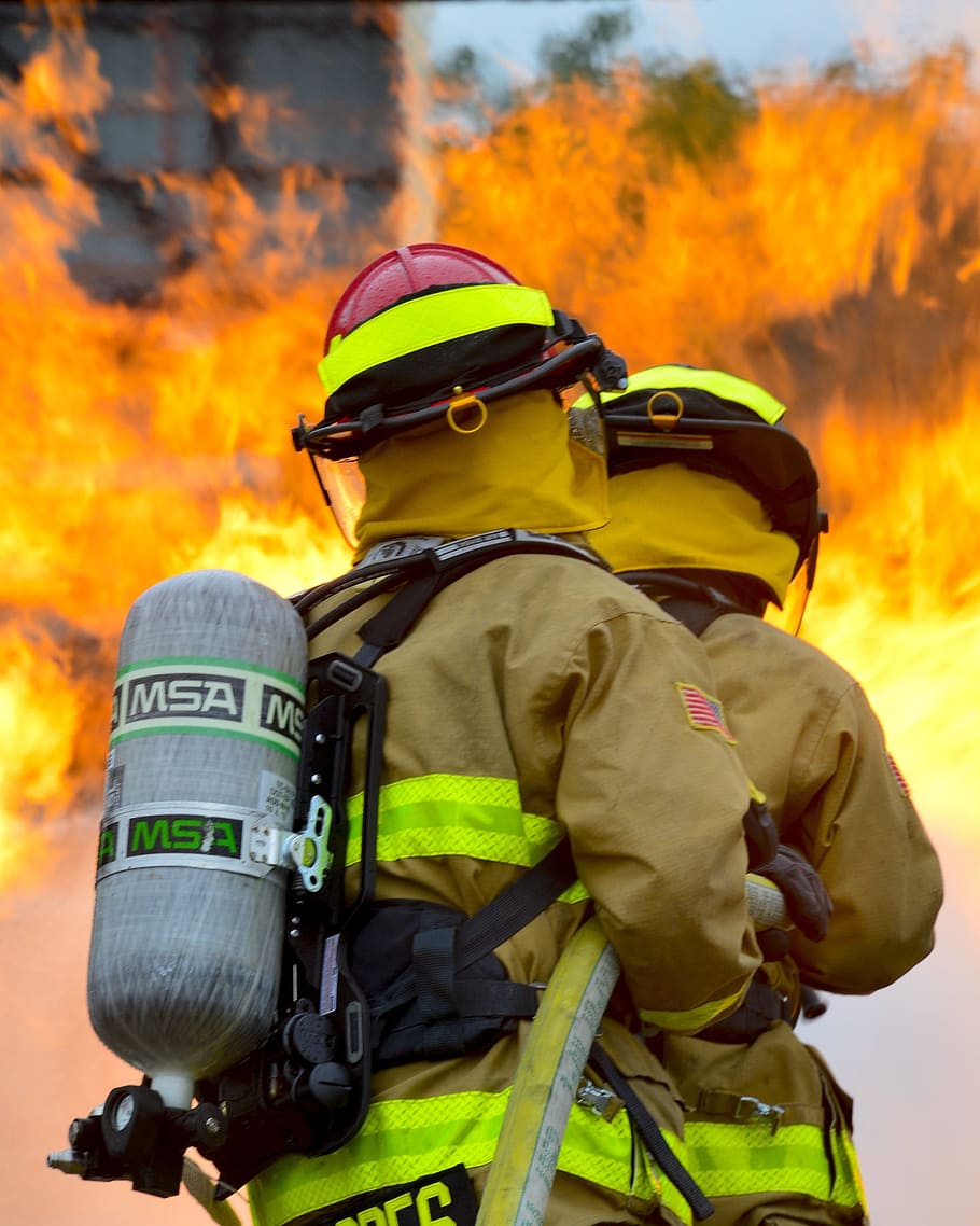 two firemen holding host near fire during daytime, firefighters HD wallpaper