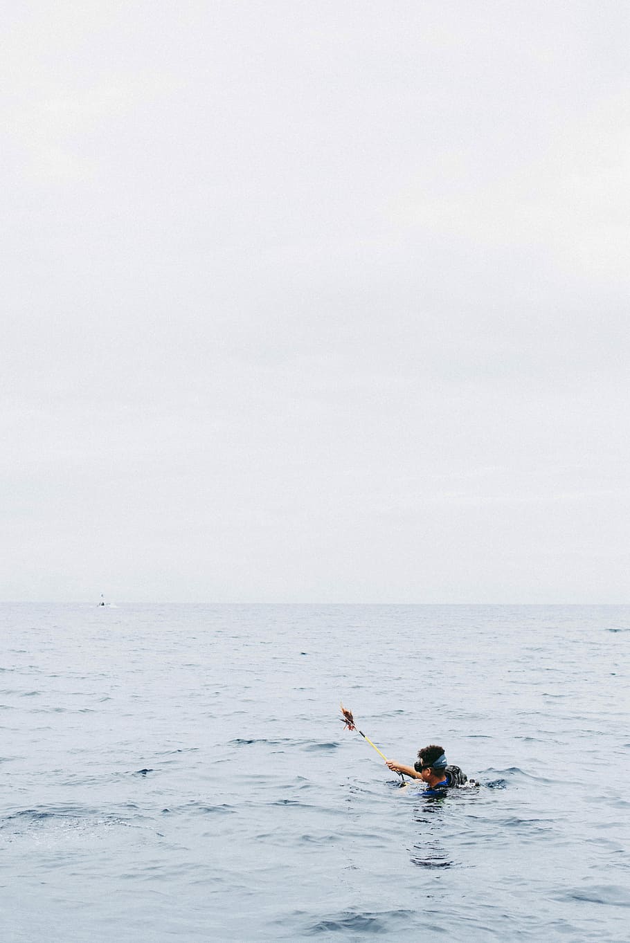 man holding rod while on water, person body of water during daytime HD wallpaper