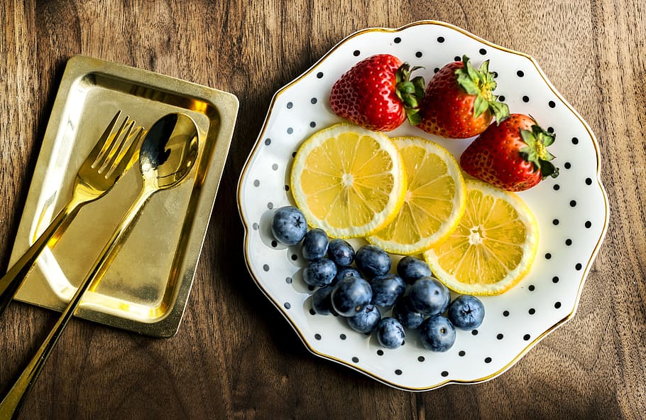 three red strawberries, blueberries and sliced lemons on white plate, HD wallpaper