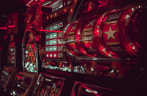 close-up photography of lucky arcade with Bar, Bar, and Star, selective focus photography of red arcade machines HD wallpaper
