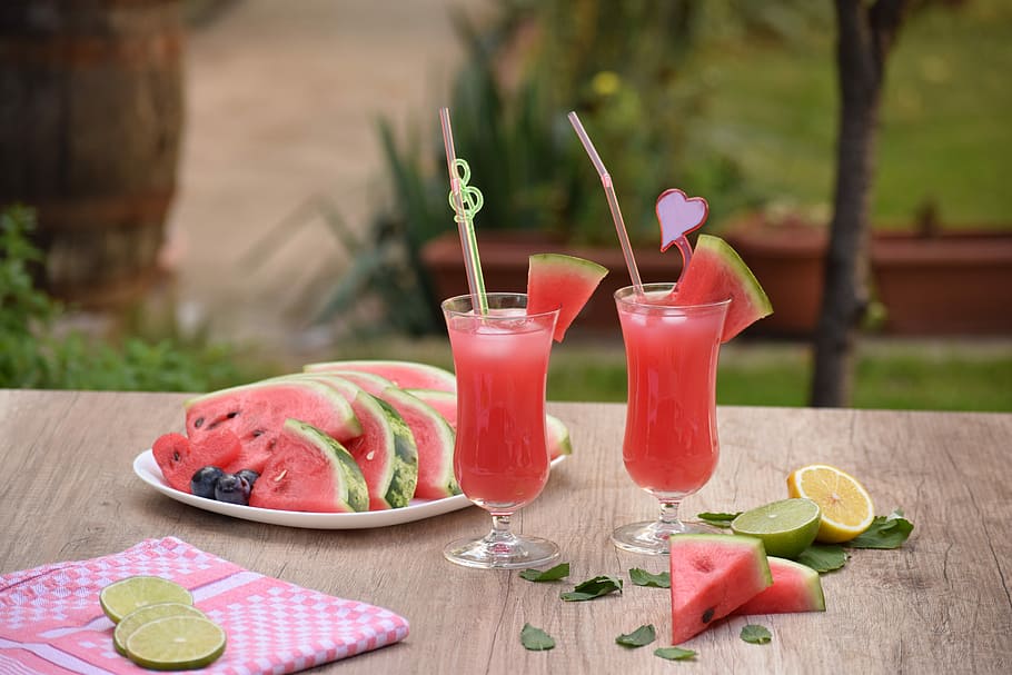 two watermelon juice and slices, table, refreshment, glass, food