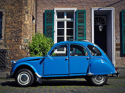 blue Citroen 2CV near brown wall bricks during daytime, auto HD wallpaper