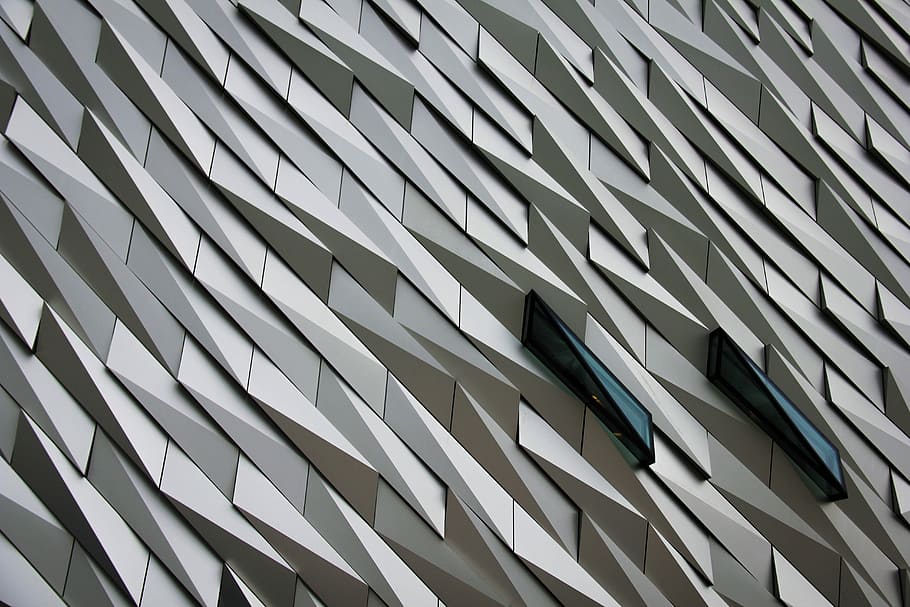 Undulating abstract shapes on a building facade at The Titanic Memorial Garden., gray and black digital wallpaper