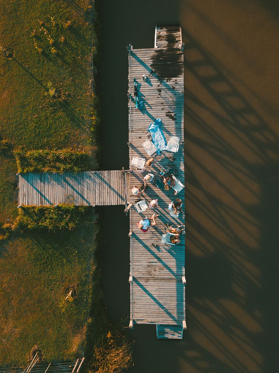 bird's eye photography of group of people gathered on dock, top view of people on top of gray dock during daytime HD wallpaper
