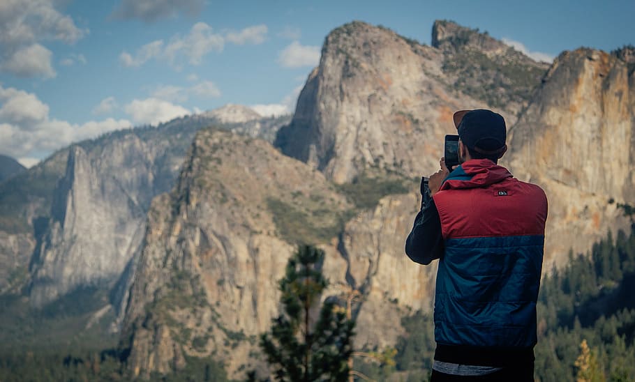 man standing while taking photo of mountain, nature, mountains HD wallpaper