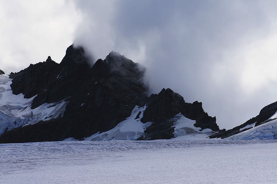 snowy mountain covered with fog, smoke over snow covered mountain HD wallpaper