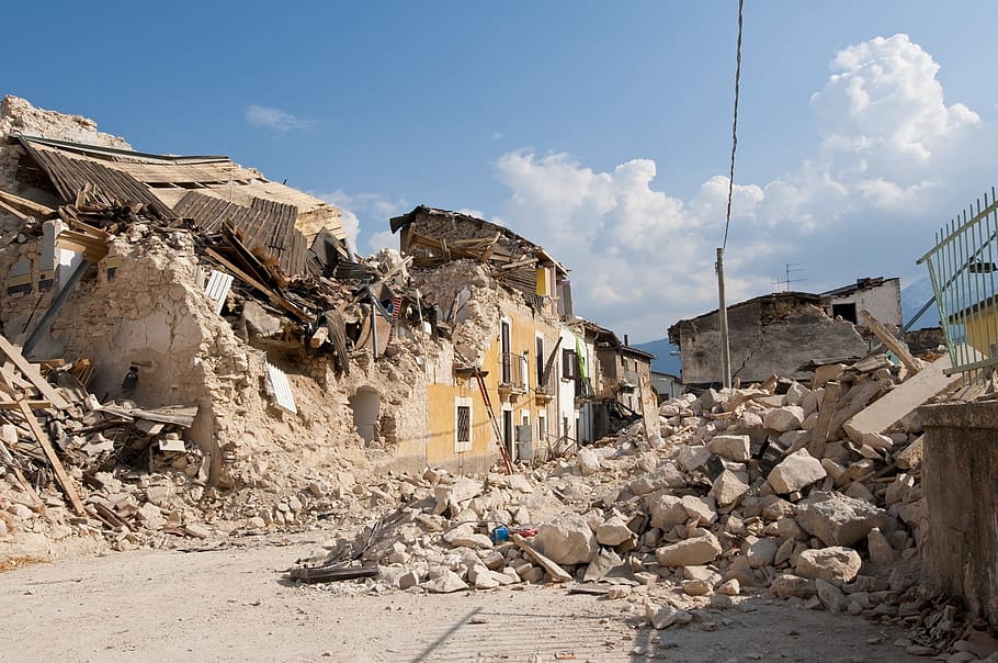 photo of brown and white demolished building, earthquake, rubble