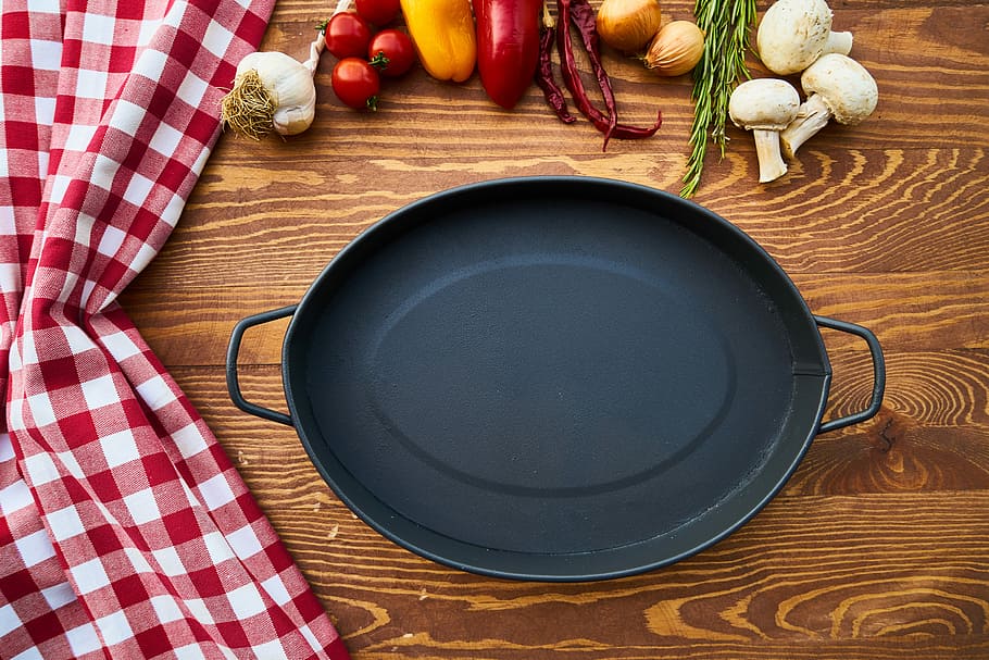 oval black steel food tray, cooking, no one, wood-fibre boards