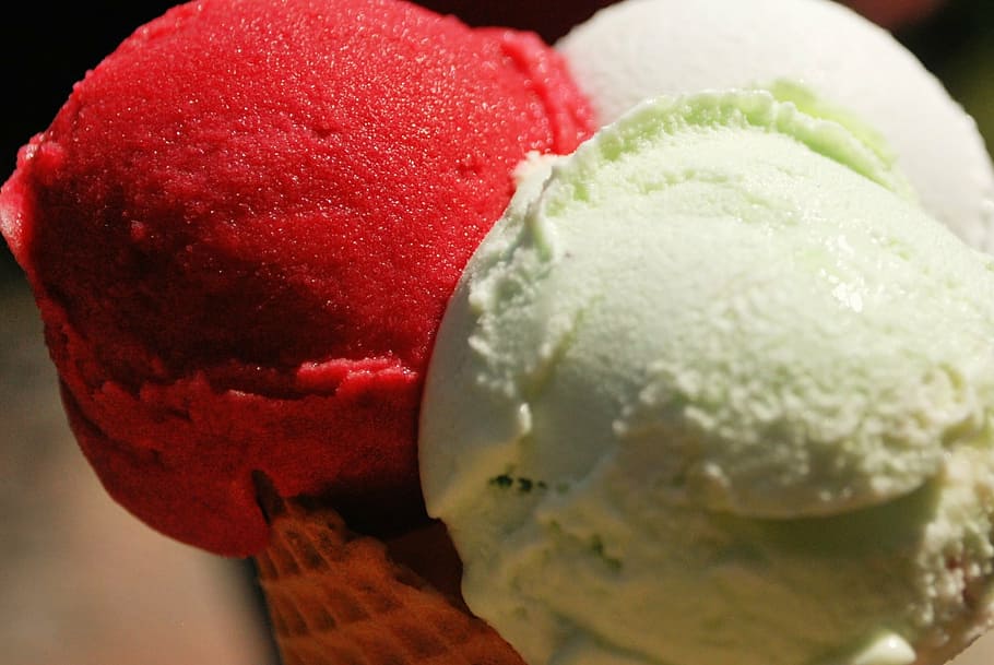 vanilla and cherry ice cream on cone, red, green, white, brown