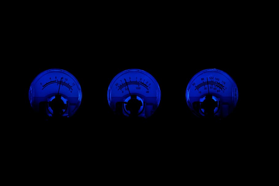 three round digital analog gauges with blue lights, technology