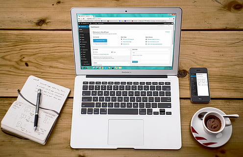 MacBook Air on brown wooden table, laptop, wordpress, wordpress design HD wallpaper