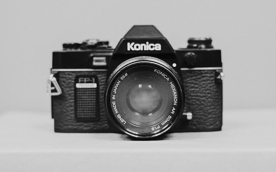 black Konica camera, black Konica DSLR camera with white background