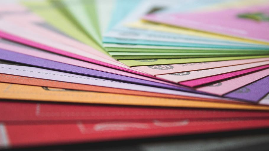 shallow focus photography of assorted books, paper, colorful HD wallpaper