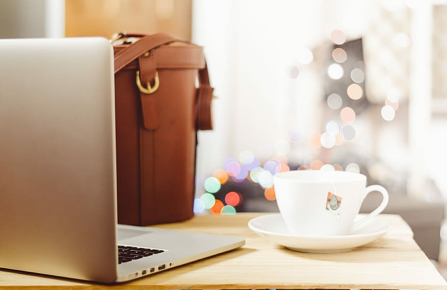 gray laptop beside teacup and bg, silver laptop computer beside white ceramic teacup with saucer HD wallpaper