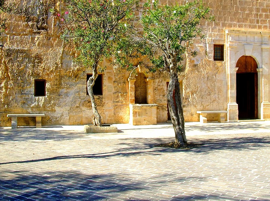brown concrete building near tree, mediterranean, village, square