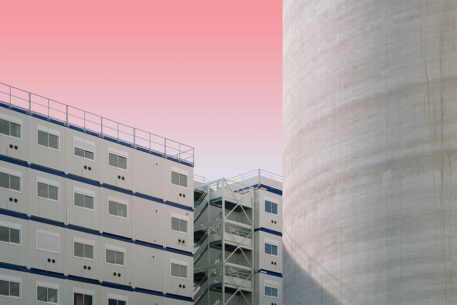 white and blue concrete structure, gray concrete buildings during daytime HD wallpaper