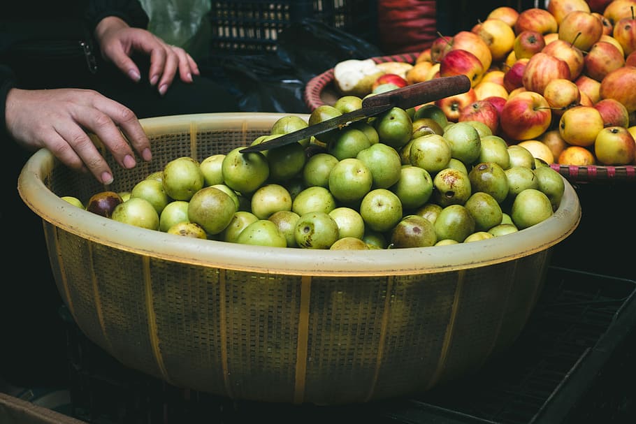 Small apples at a market, fruit, hands, outside, food, freshness HD wallpaper