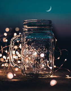 Shallow Focus Photograph of Clear Glass Mason Jar With Fairy Lights HD wallpaper