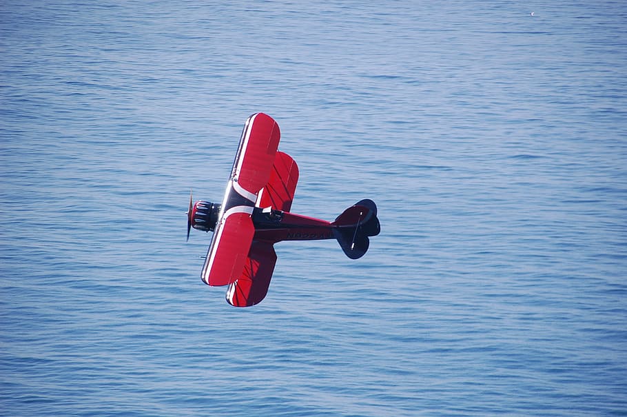 aircraft, biplane, flight, water, one person, red, day, waterfront HD wallpaper