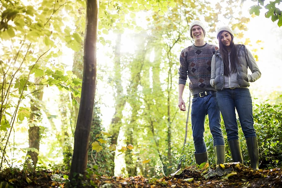 man and woman walking on forest during daytime, green, nature HD wallpaper