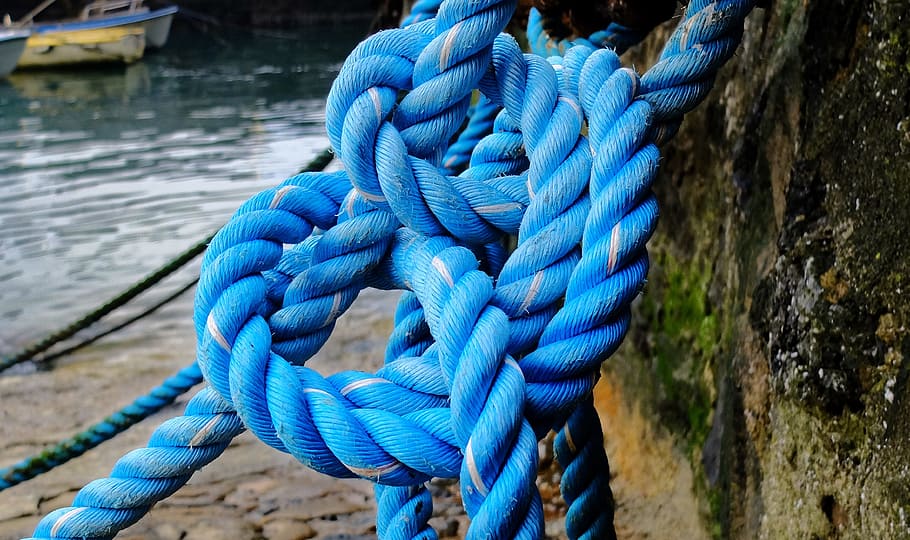 closeup photo of blue rope, dock, boat, sea, anchor, knot, fishermen