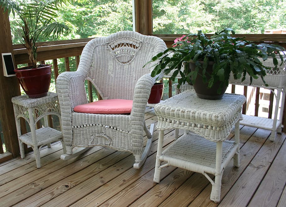 white woven armchair and side table, wicker rocking chair, porch