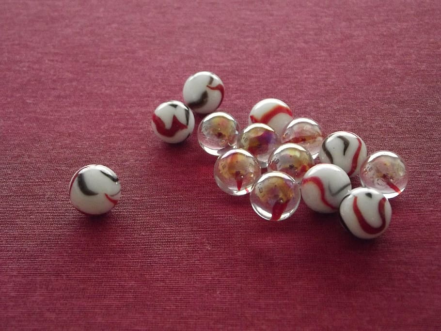 white and clear marble toys on red pad, team, leader, chief HD wallpaper