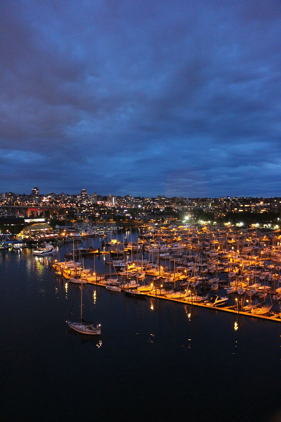 aerial photo of boat docks with lights under cloudy sky at night, HD wallpaper