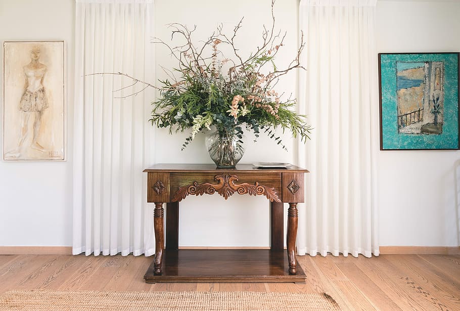 green leafed plant on vase near wall, brown wooden console table with clear glass vase on top HD wallpaper