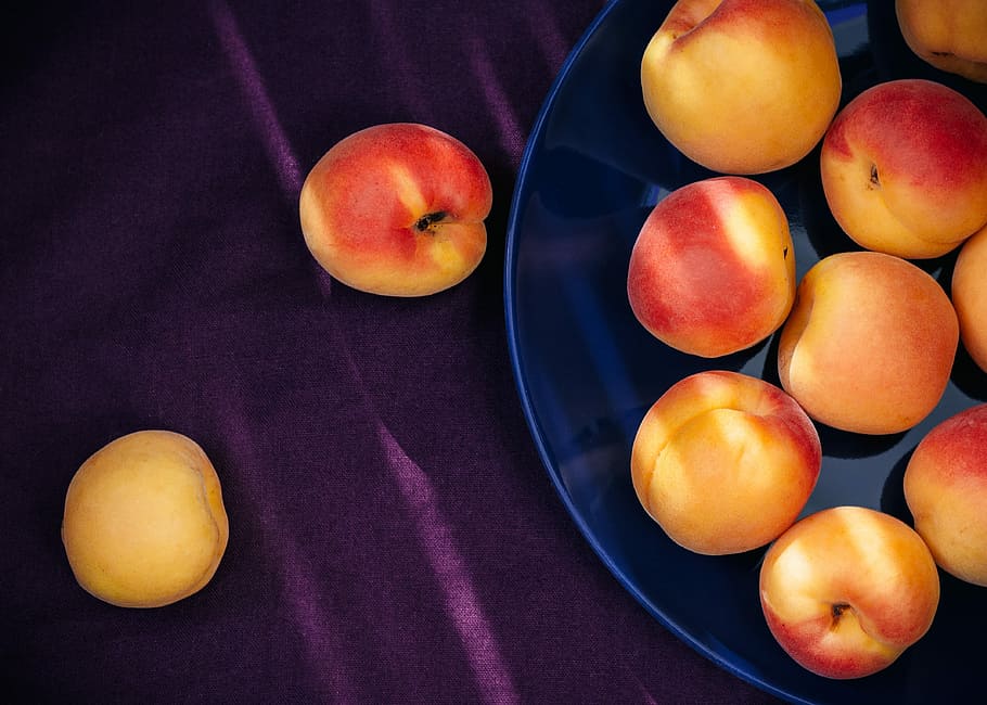 yellow-and-red apple fruits on plate, apricots, orange, purple HD wallpaper