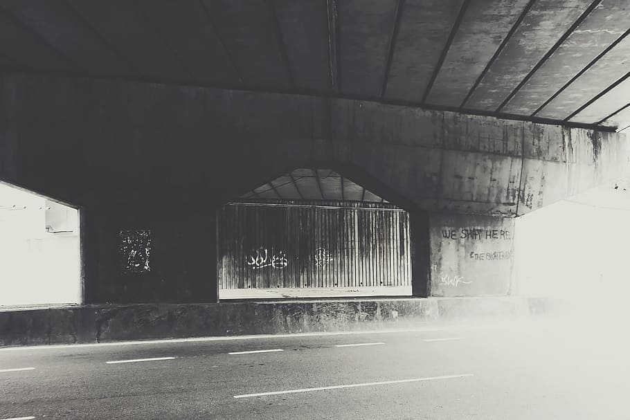 grayscale photo of gray road, overpass, pavement, graffiti HD wallpaper