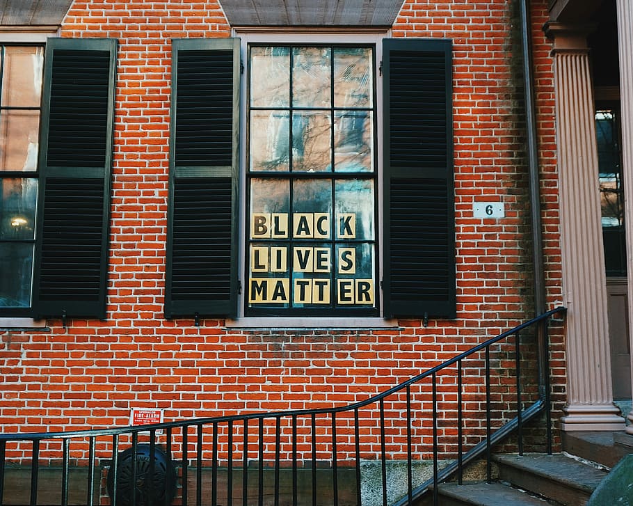 black lives matters poster on window, black wooden 2-door louver mirror during daytime HD wallpaper
