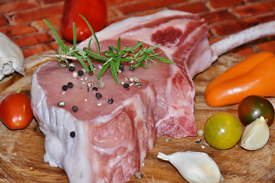 sliced raw meat and black pepper on top, pig, pig back, pork