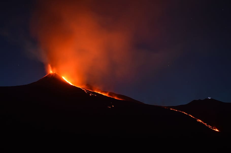 black mountain with flowing lava at nighttime, time lapse photography of volcano eruption HD wallpaper