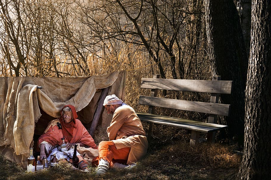 man and woman painting in the woods, potion, poverty, misery