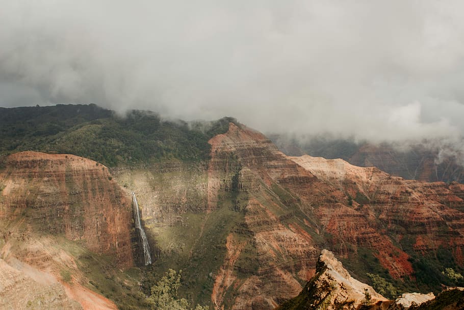 brown mountain at daytime, brown and black mountain under cloudy sky during daytime HD wallpaper