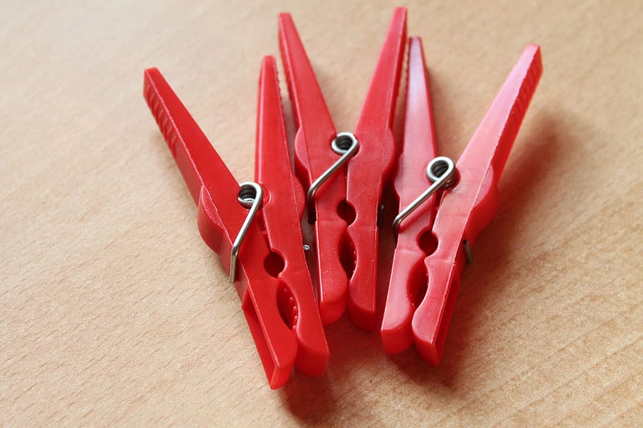 clothespins, red, clamp, plastic, table, indoors, still life HD wallpaper