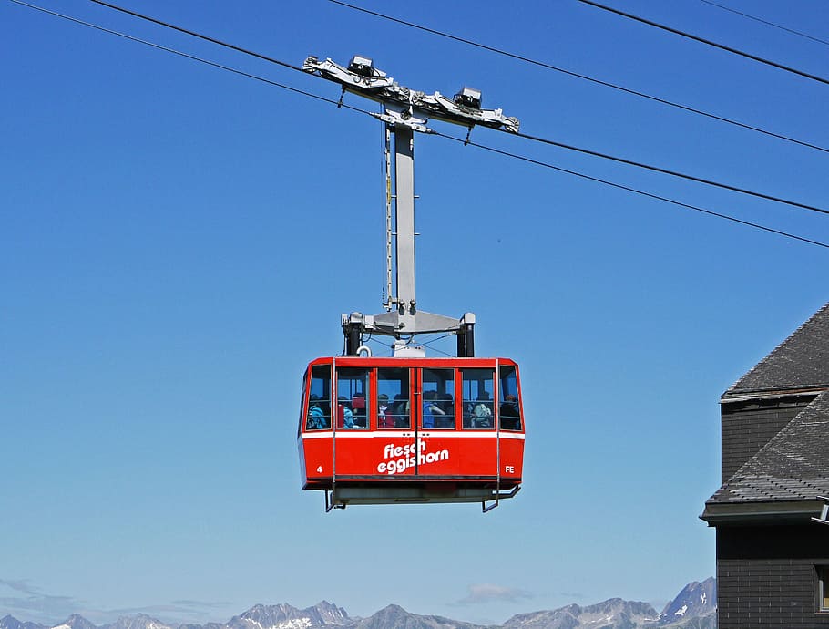 red, white, and black cable car at daytime, switzerland, fiesch