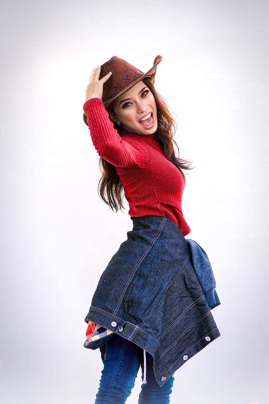 woman wears red long-sleeved shirt, girl, denim, hat, cowgirl
