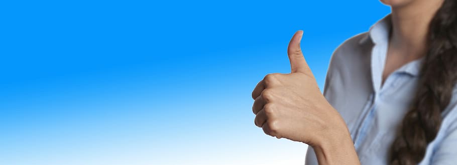 woman wearing blue collared button-up showing thumbs up, startup HD wallpaper