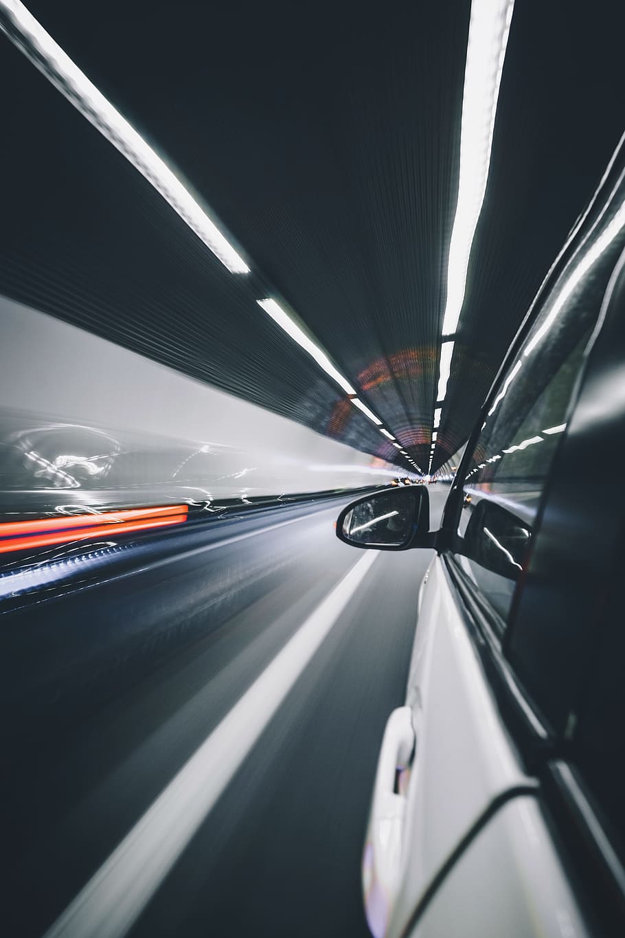 photography of wing mirror, white car travelling in gray tunnel HD wallpaper