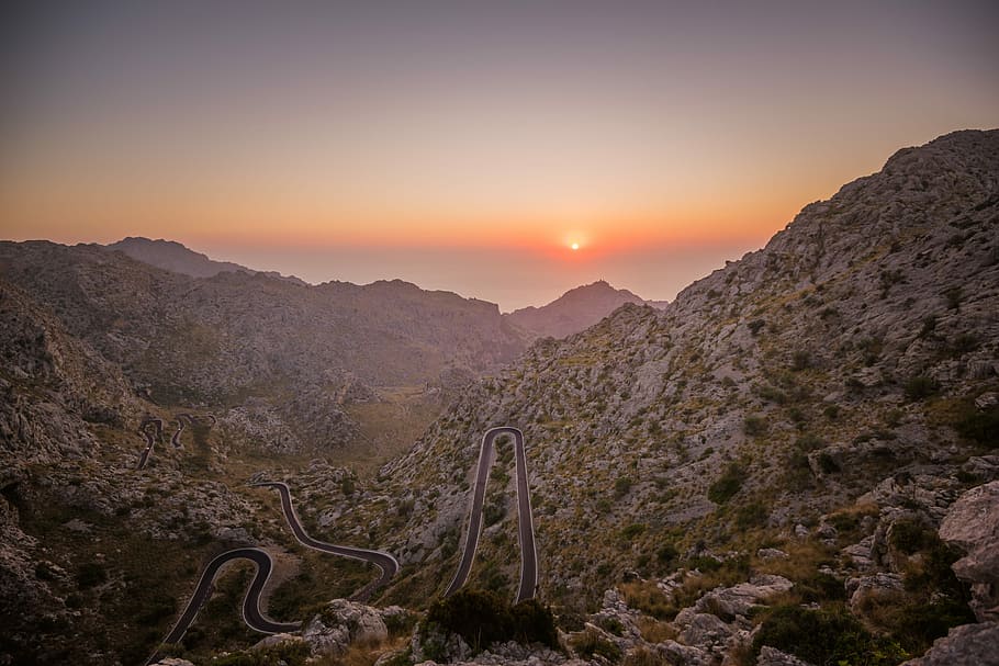 snake road in mountain field, aerial view of mountain during sunset HD wallpaper