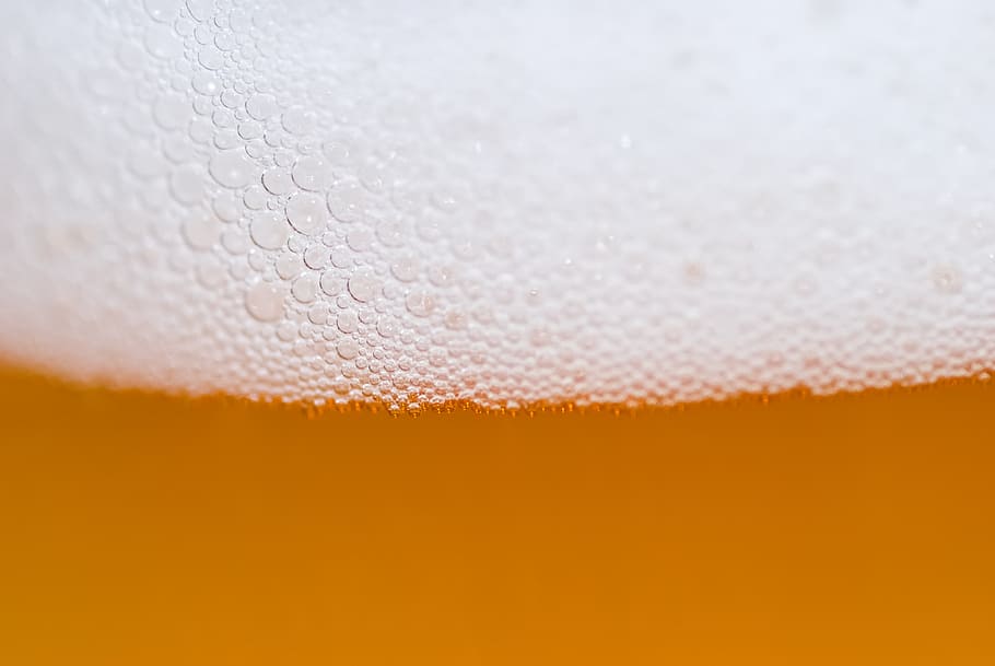 macro photograph of liquid substance, beer, foam, bubbles, alcohol