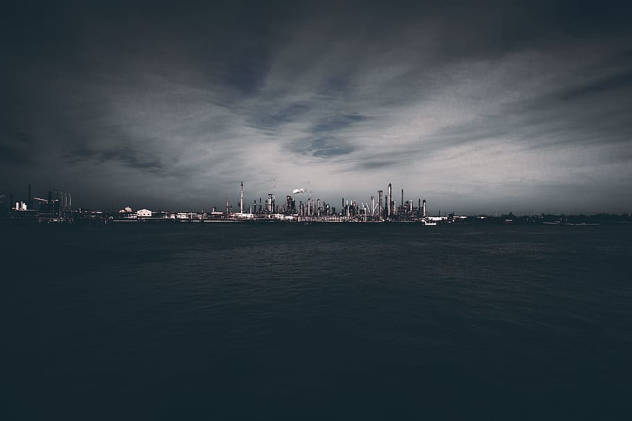 skyscrapercity under gray skies, city can be seen near body of water HD wallpaper