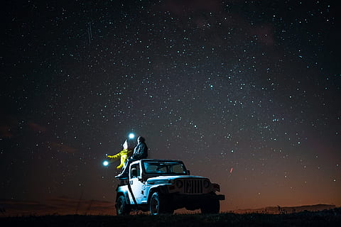 person sitting on top of wrangler under starry sky, untitled HD wallpaper